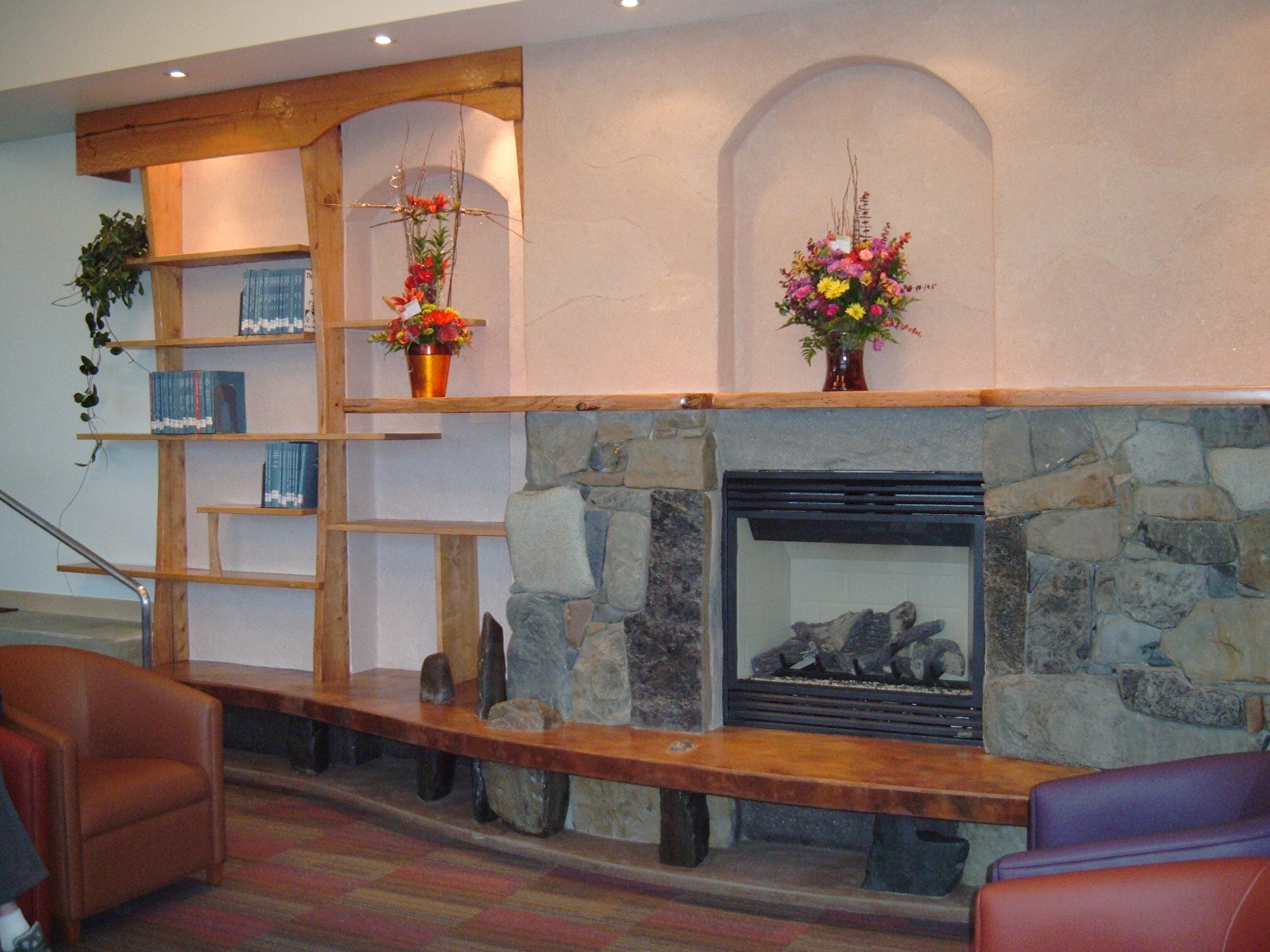 Fireplace hearth and bookshelves by Leo Vait