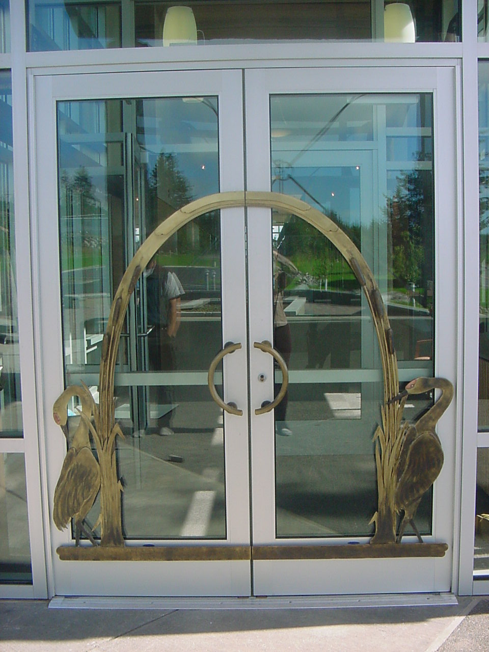 Cranes on entrance door by Mooserun Metalsmiths