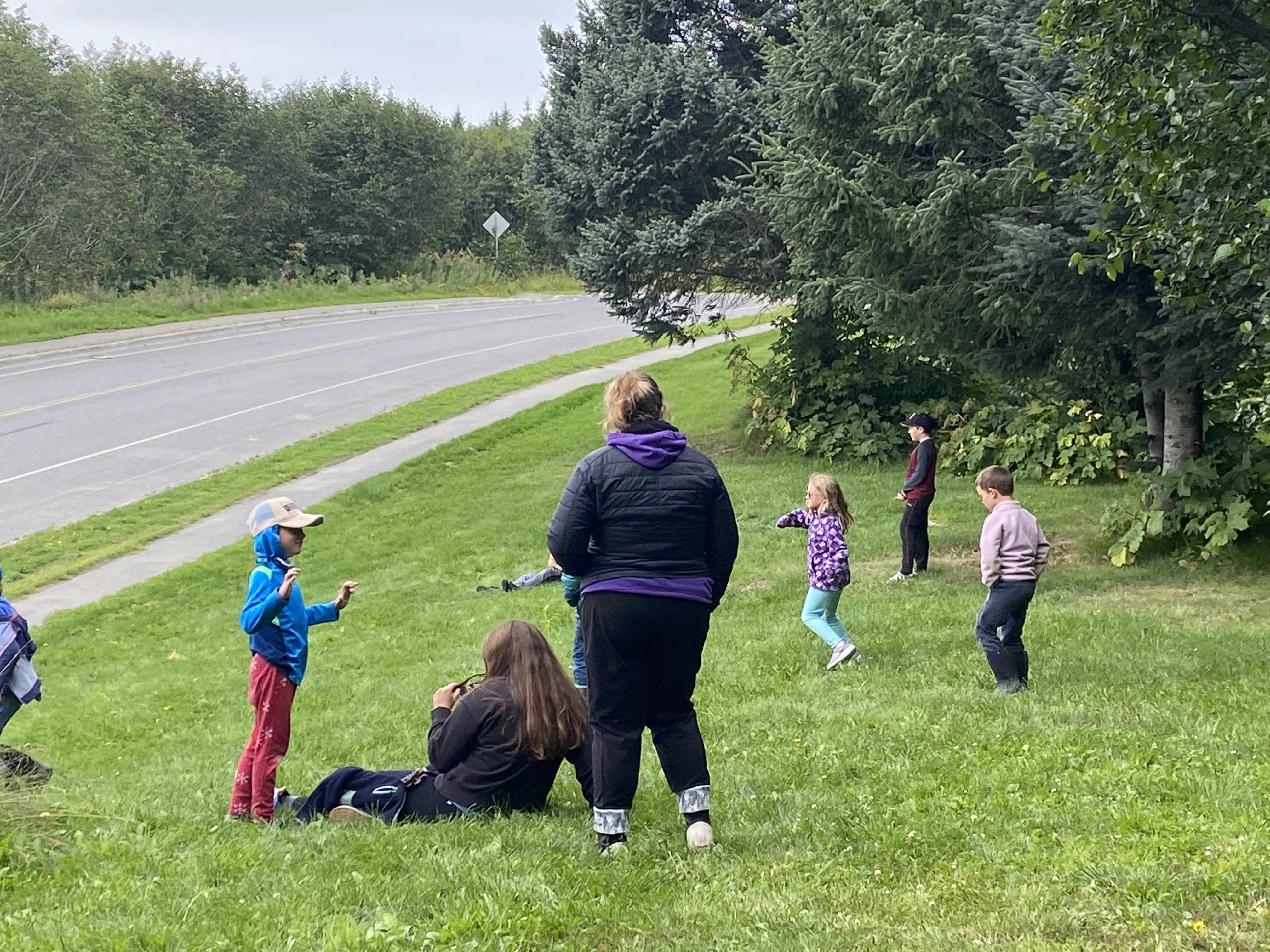 Photo of kids and CACS counselors on the library's western lot