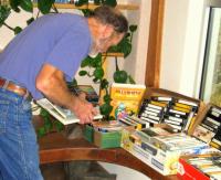 Patron browsing the book and plant sale