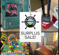 collage of boxed tv's, a boot dryer, a wooden toy and an industrial blower with the City of Homer logo and words, Surplus Sale