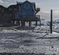 Waves eroding beach on western side of Homer Spit