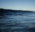 Photograph of large blue ocean swell.