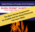 Yellow banner across a Burn Permit Suspension notice saying, Burn Permit Suspension has been lifted for Kenai Peninsula & Kodiak