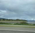 Photo of Mud Bay with rainbow hovering over top 