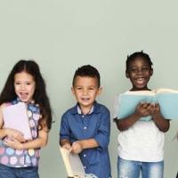 five standing kids holding books