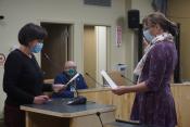 Homer City Clerk Jacobsen administers the Oath of Office to re-elected Councilmember Donna Aderhold.