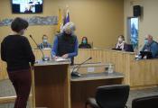 Newly elected City Council member Shelly Erikson signs Oath of Office in Cowles Chambers on October 11.