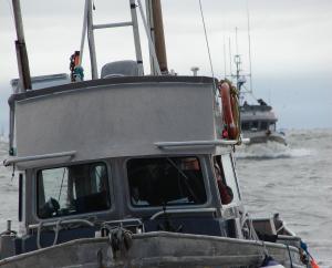 Close range photo of front of wheel house of an aluminum commercial fishing boat
