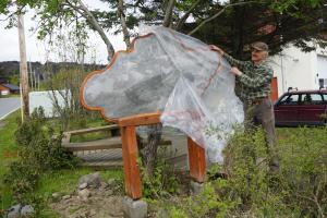 Artist Jeffrey Dean unveils a new brass etching sculpture titled Nor'easter in the pocket park next to Homer's Fire Hall.