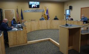 City Manager Dumouchel and Homer City Council members sitting at the dais in Cowles Chambers.