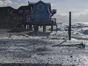 Waves eroding beach on western side of Homer Spit