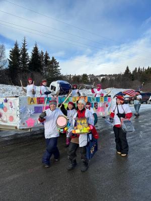 Megumi Beam and the Japanese Club Students marching in Homer's Winter Carnival Parade 2024