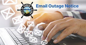 Two hands typing on a keyboard with the City of Homer logo and the words Email Outage Notice
