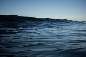 Photograph of large blue ocean swell.