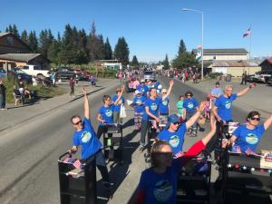 The Homer Public Library's Drill Cart Team performing on Pioneer Ave.