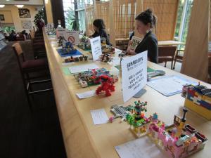 People enjoying lego creations in the library. 