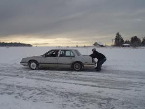 Pushing a stuck car in winter