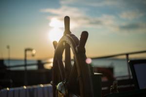 Ships wheel at sunset
