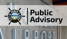 Homer Airport Terminal lettering on building with Public Advisory saying terminal is temporarily closed and flights are rerouted