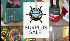 collage of boxed tv's, a boot dryer, a wooden toy and an industrial blower with the City of Homer logo and words, Surplus Sale